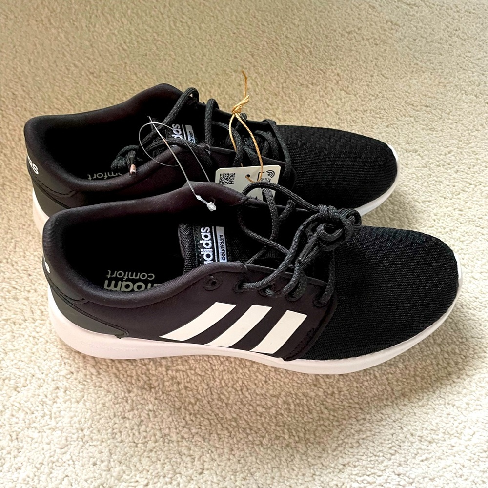 Black Adidas running shoes.